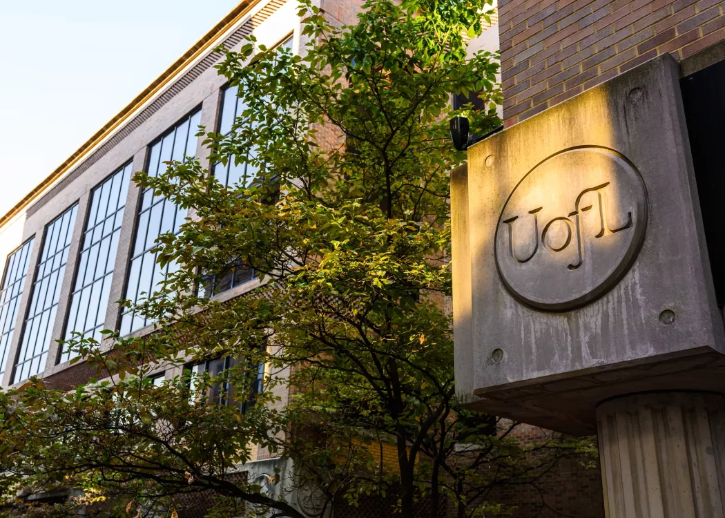 Exterior of the School of Nursing on the HSC Campus as sunset approaches.