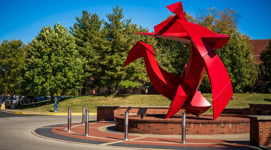 Wide-angle of the Big Red sculpture outside of the College of Business